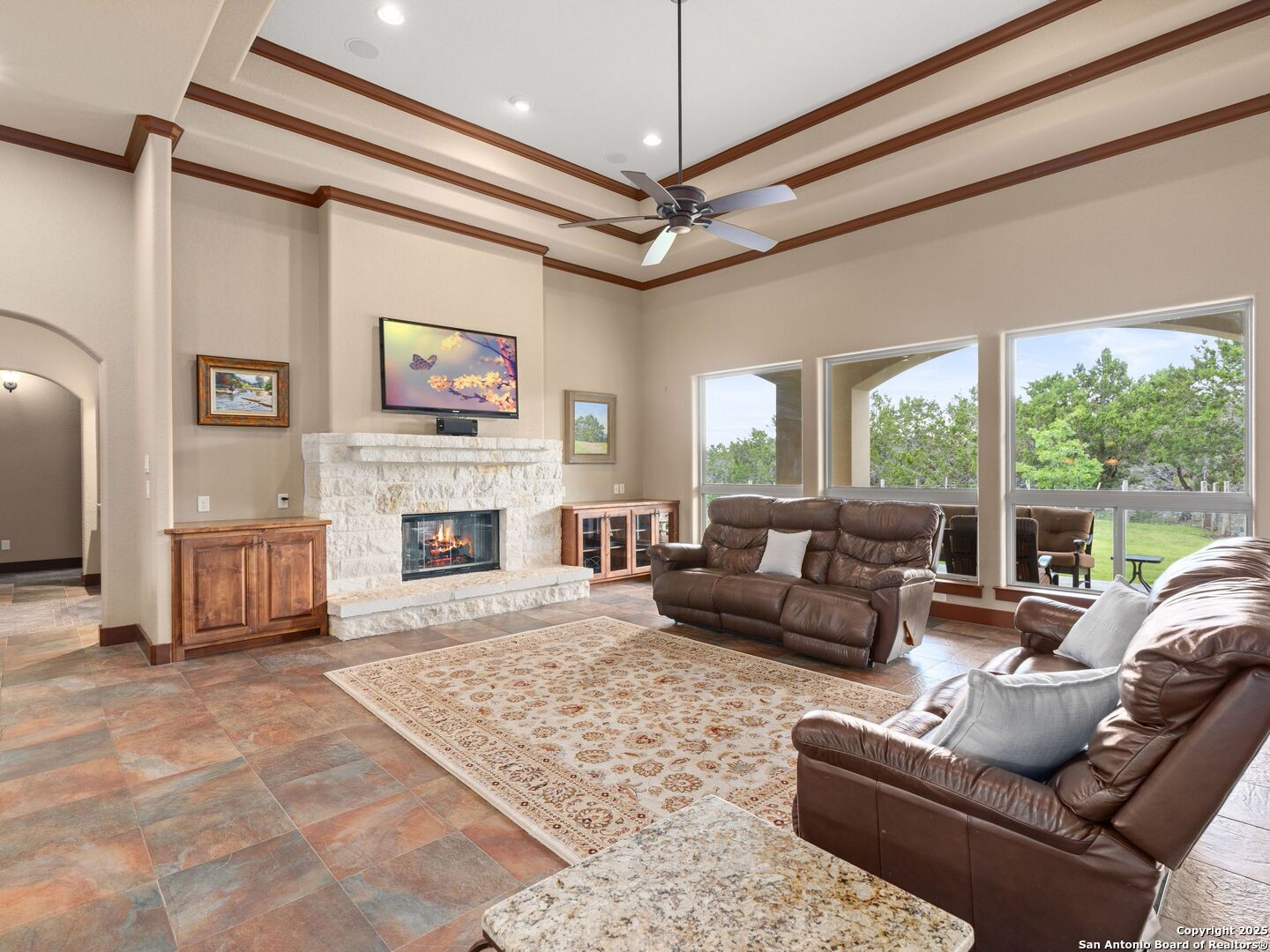 103 Falcon Crest Boerne, TX 78006 - Photo 7 of 35 a living room with furniture a large window and a fireplace