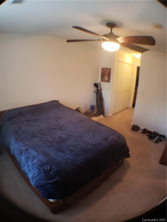 8360 Rudolph Road, Unit 2105 Charlotte, NC 28216 - Photo 7 of 14 a bed sitting in a bathroom next to a window
