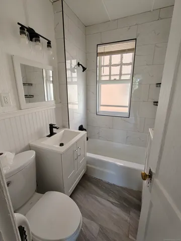 a bathroom with a toilet sink and bathtub