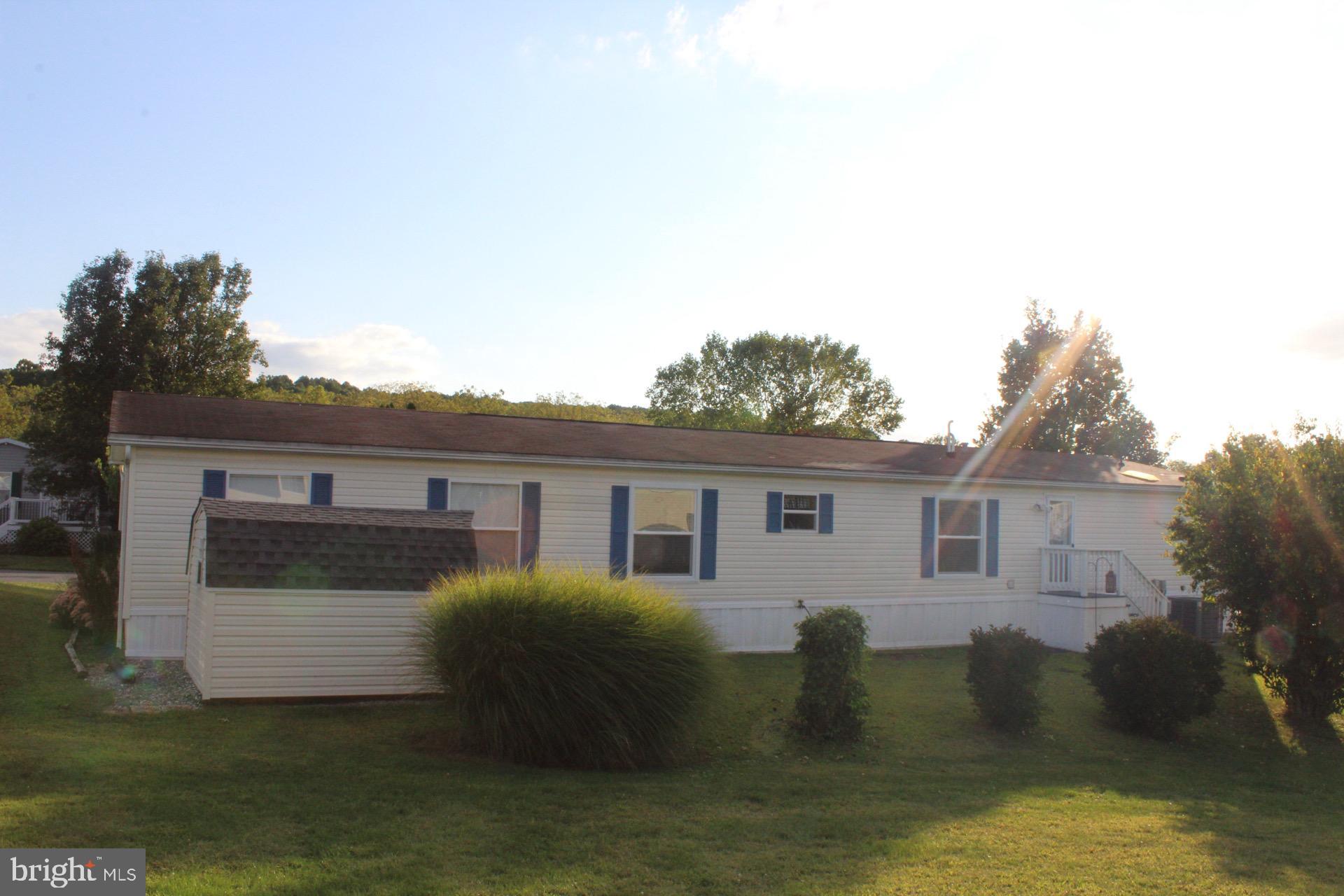 8 Williams Way Avondale, PA 19311 - Photo 23 of 24 Charming home with lush green surroundings.