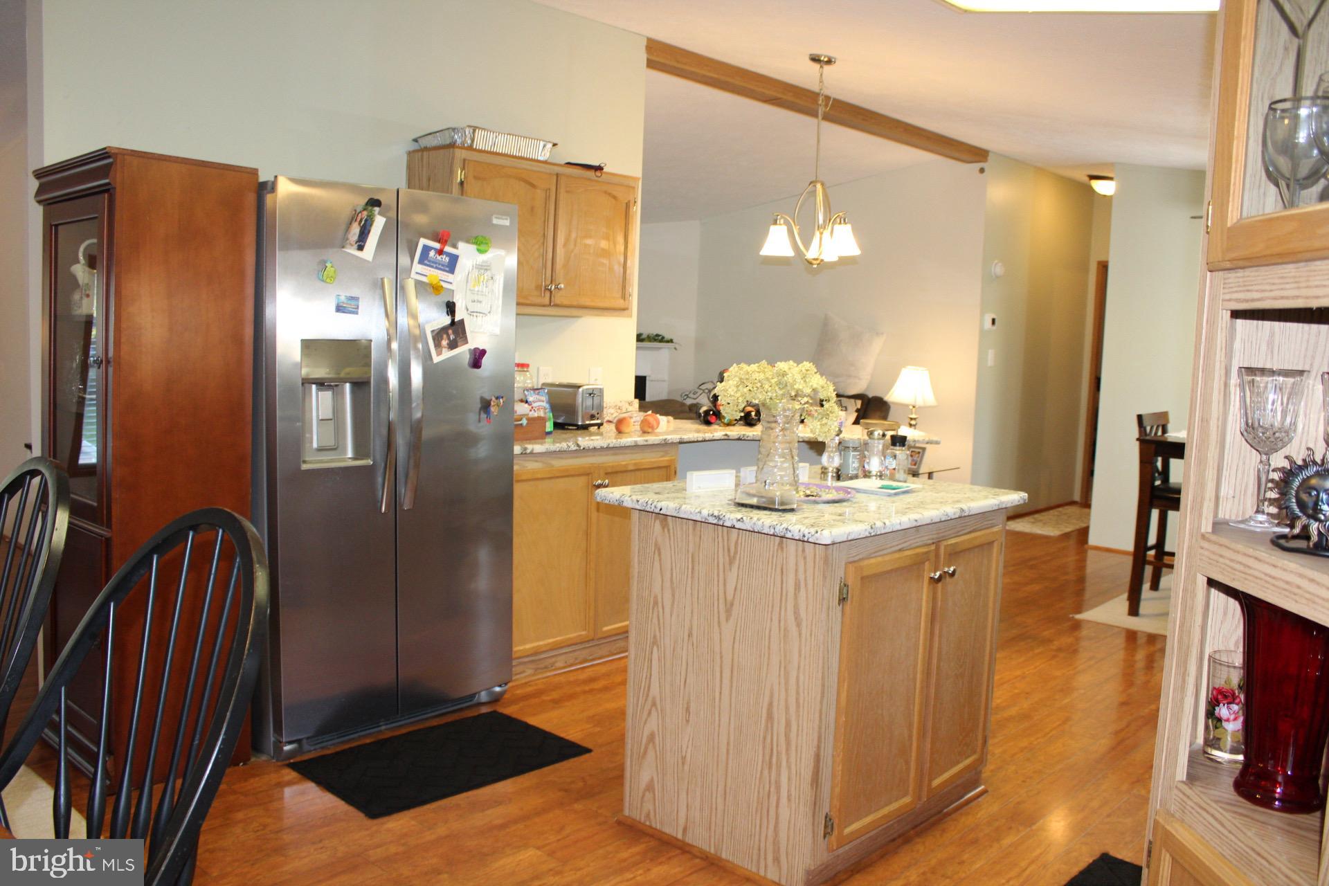 8 Williams Way Avondale, PA 19311 - Photo 5 of 24 Inviting kitchen with warm wood accents.