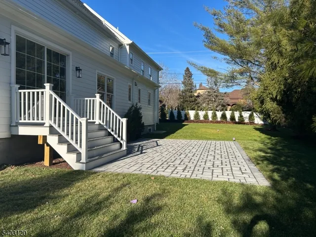 a view of a brick house with a yard
