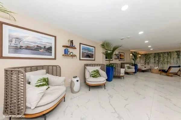 a living room with furniture and a table