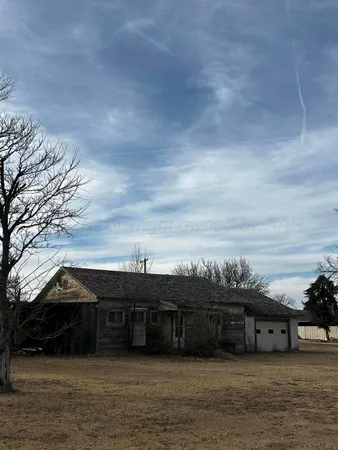 a view of house with outdoor space