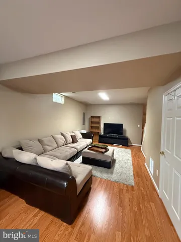 a bathroom with a double vanity sink toilet mirror and shower