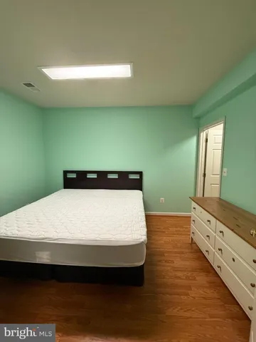 a view of workspace with wooden floor and windows