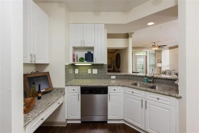 a living room with furniture and large windows
