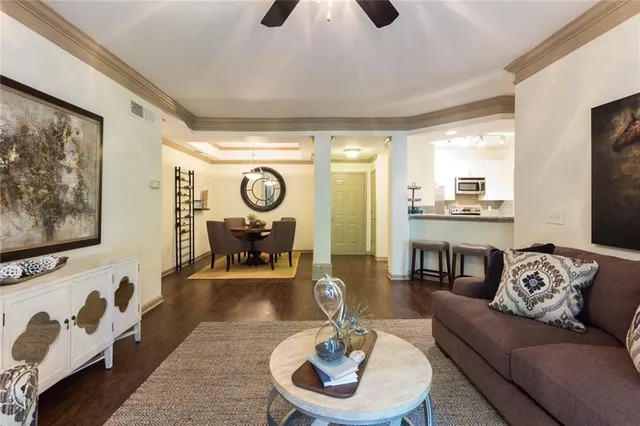 a dining room with furniture and a mirror