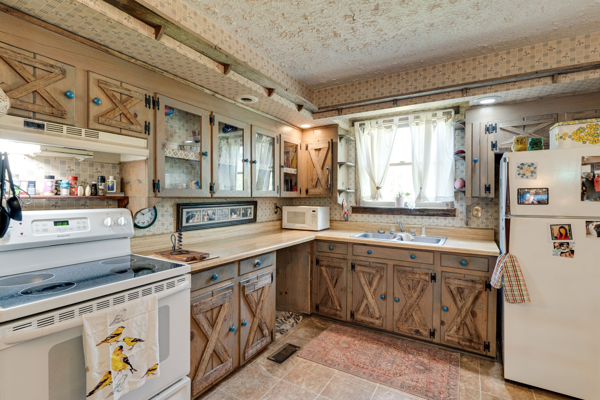 2729 Gideon Road Greenbrier, TN 37073 - Photo 6 of 30 a kitchen with a sink a stove and cabinets