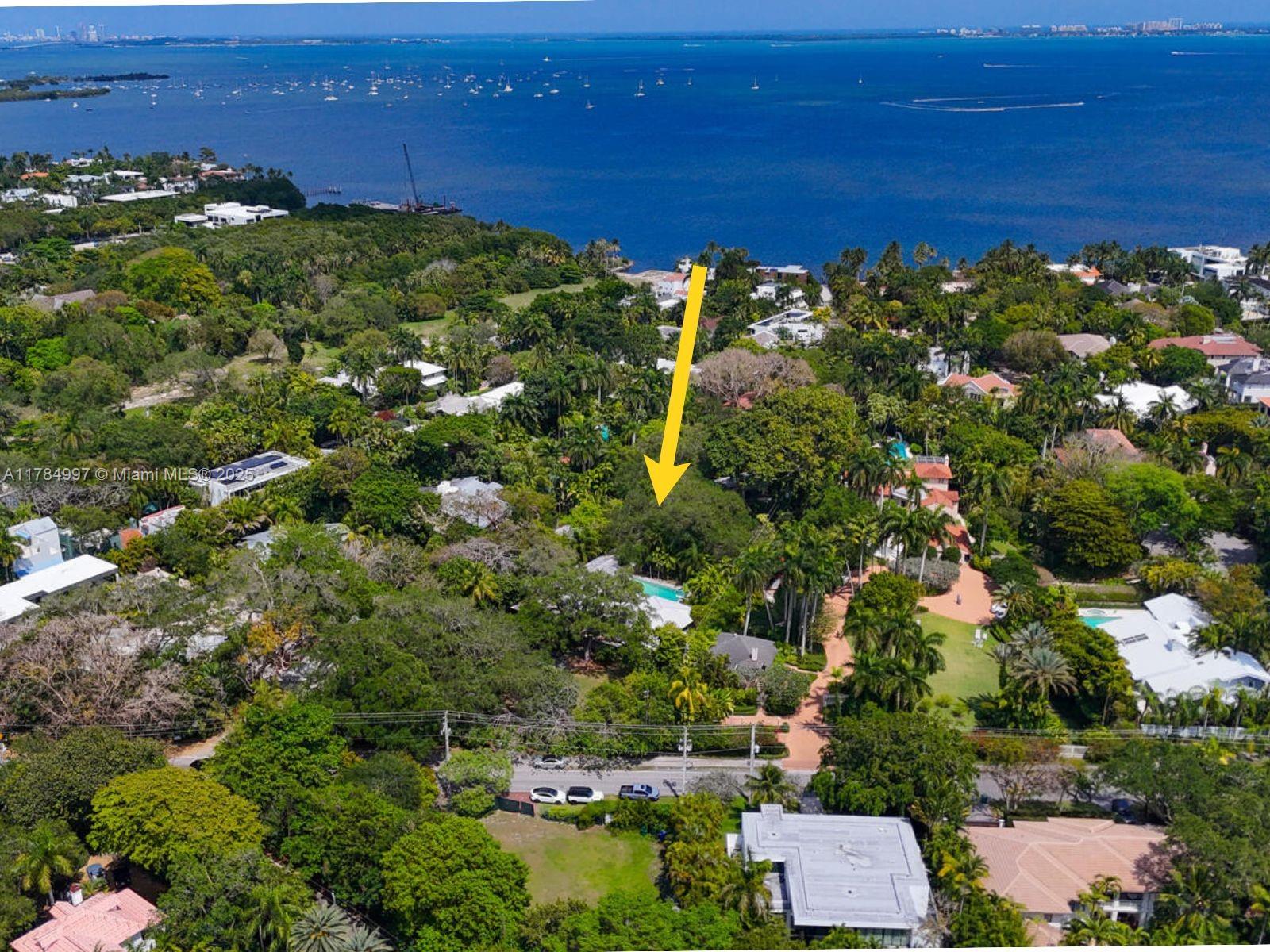 4151 Douglas Road Miami, FL 33133 - Photo 2 of 24 an aerial view of residential houses with outdoor space and trees