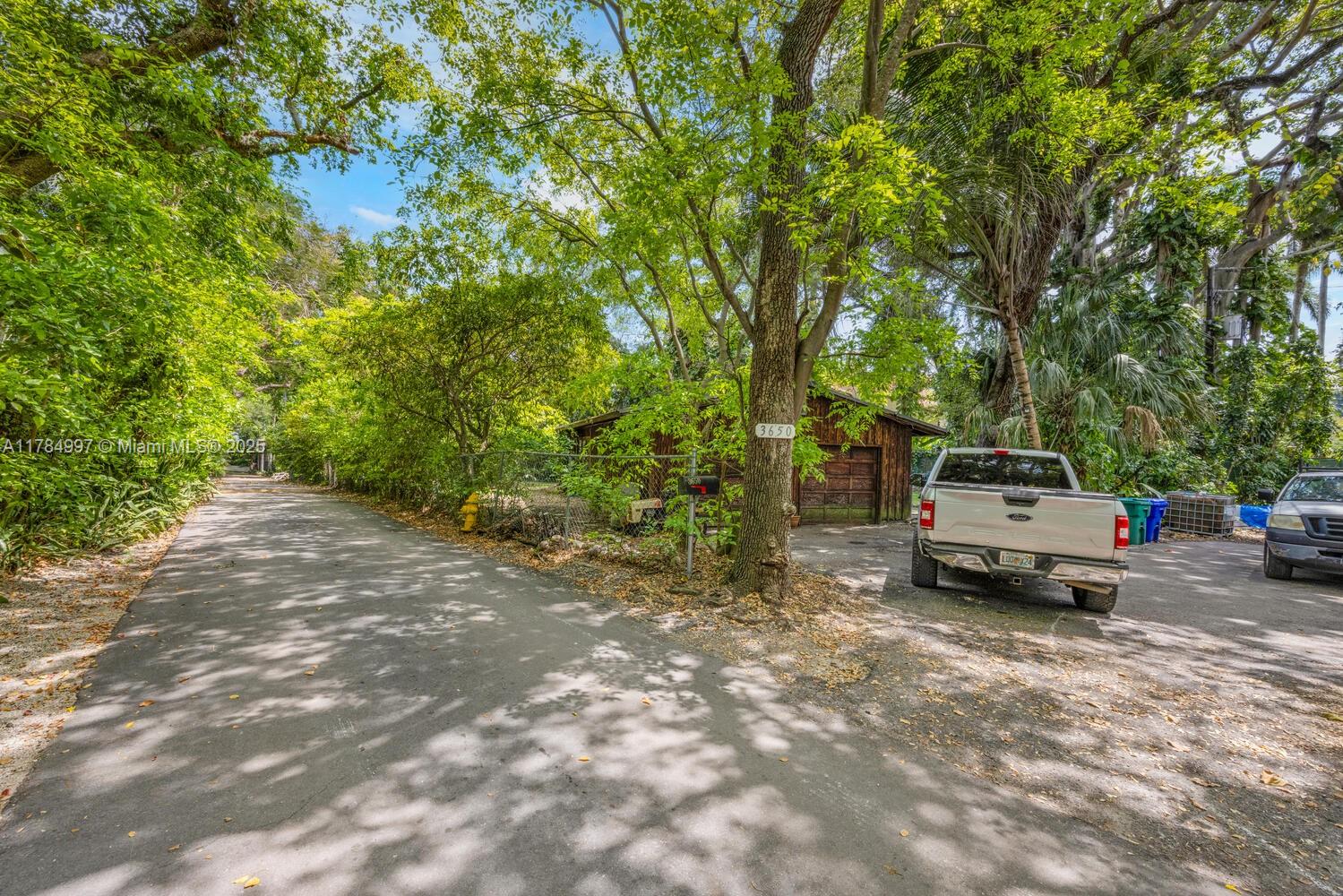 4151 Douglas Road Miami, FL 33133 - Photo 21 of 24 a car parked in front of a house