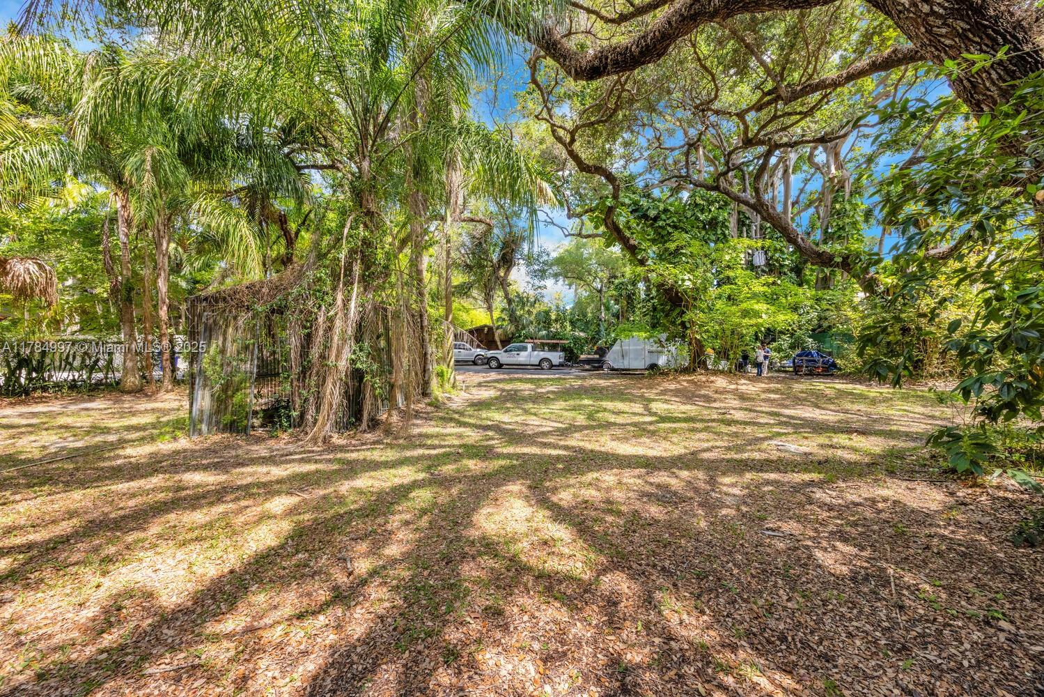4151 Douglas Road Miami, FL 33133 - Photo 23 of 24 a view of green field with trees