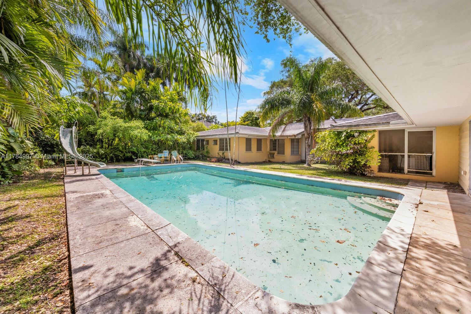 4151 Douglas Road Miami, FL 33133 - Photo 24 of 24 a view of a house with a yard