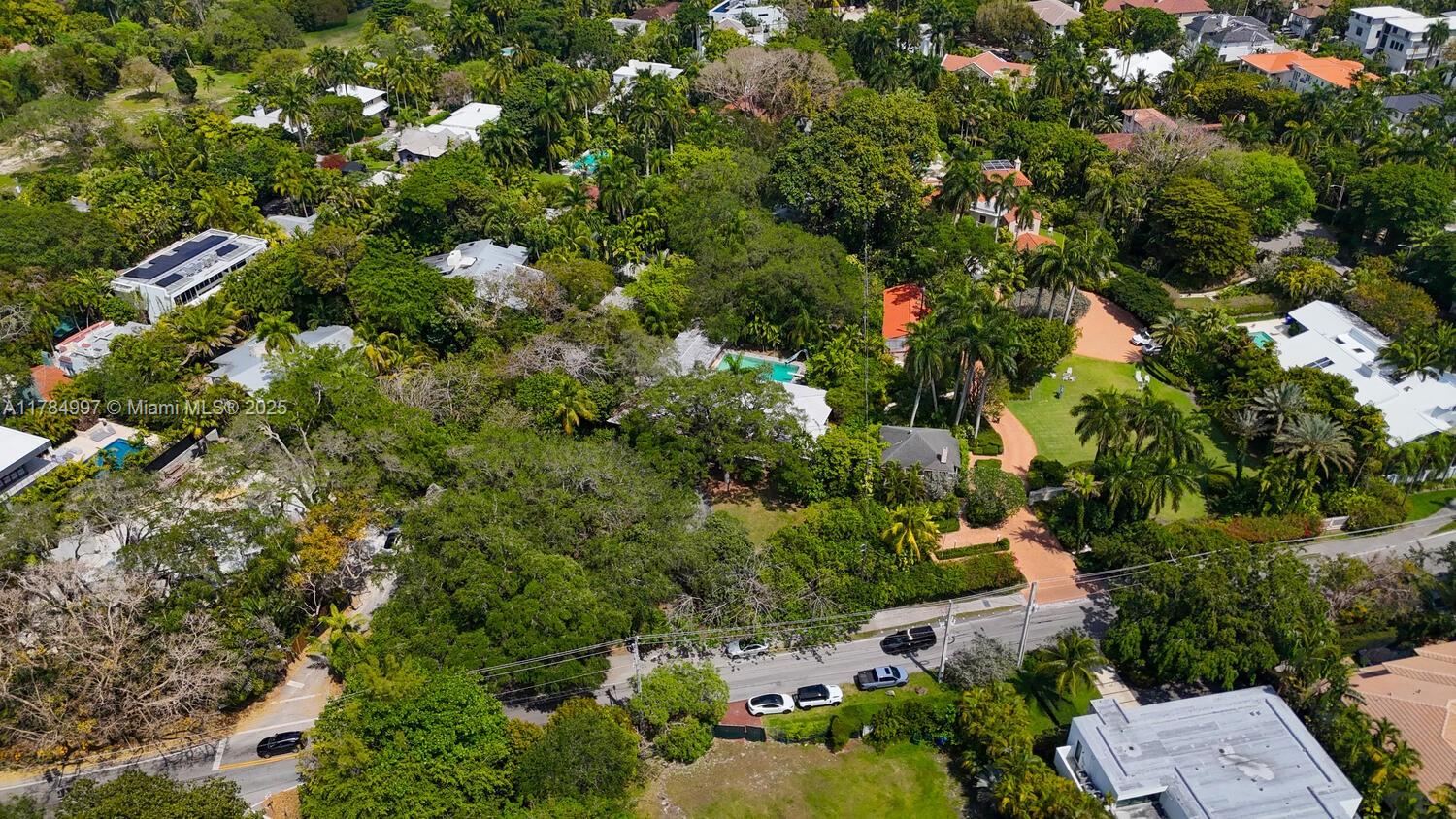4151 Douglas Road Miami, FL 33133 - Photo 4 of 24 an aerial view of residential houses with outdoor space and trees