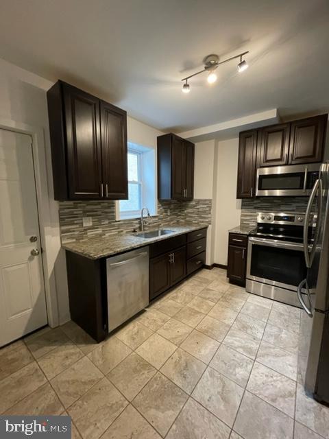 1750 Waterloo Street Philadelphia, PA 19122 - Photo 1 of 15 a kitchen with stainless steel appliances granite countertop a stove a sink and a refrigerator