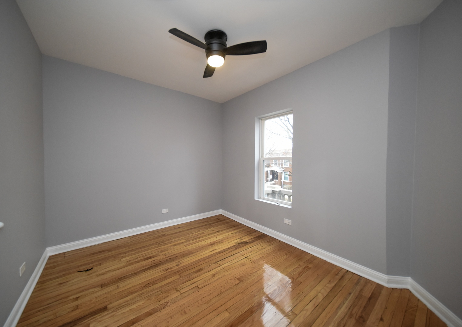5932 South Elizabeth Street Chicago, IL 60636 - Photo 11 of 25 wooden floor in an empty room with a window