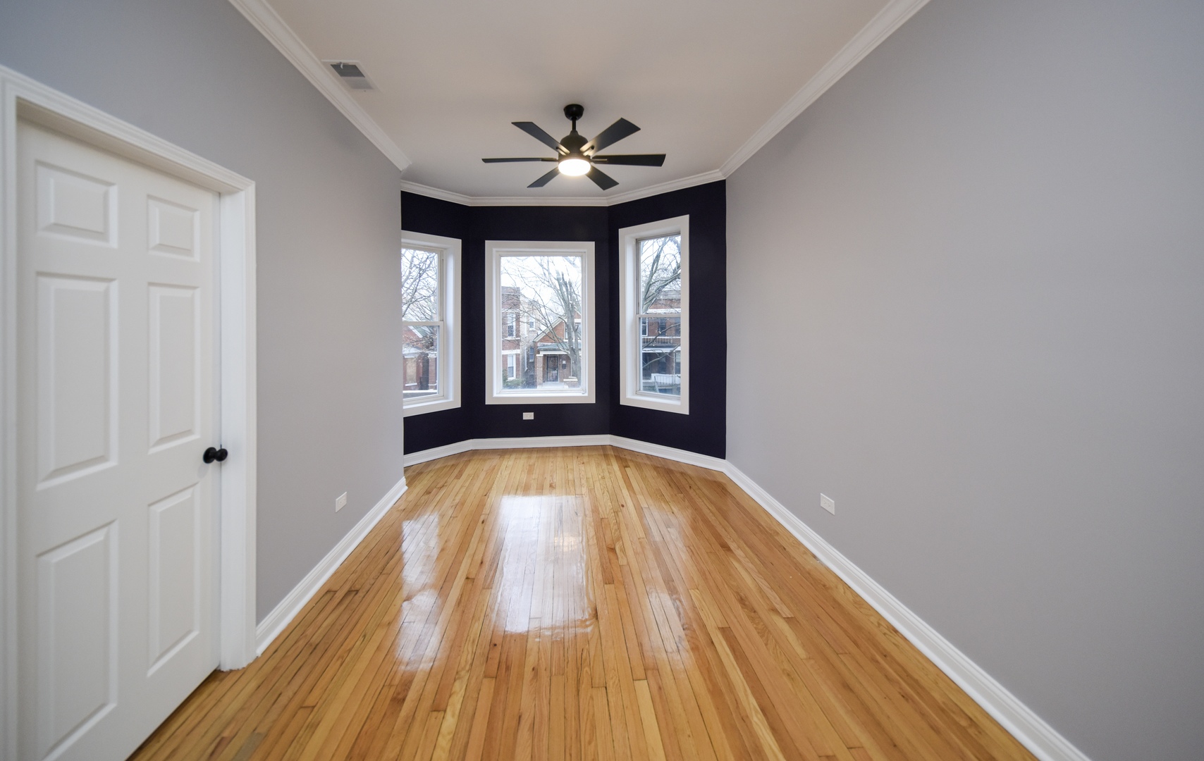 5932 South Elizabeth Street Chicago, IL 60636 - Photo 15 of 25 a view of empty room with wooden floor and fan