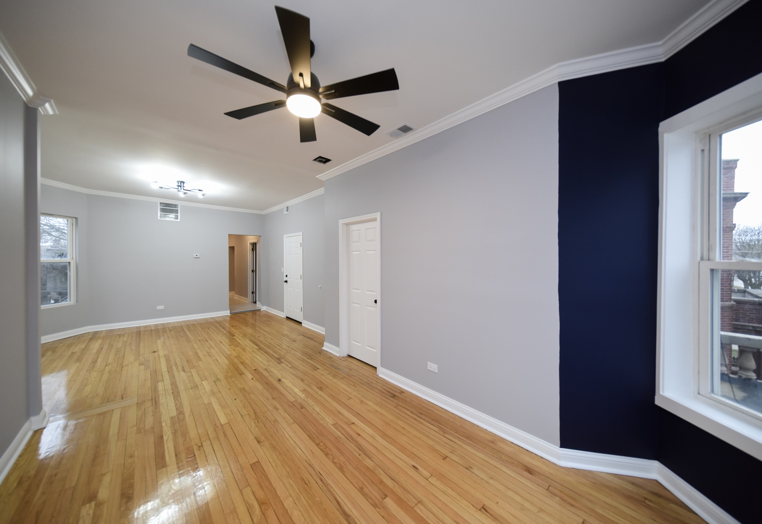 5932 South Elizabeth Street Chicago, IL 60636 - Photo 16 of 25 a view of empty room with wooden floor and fan