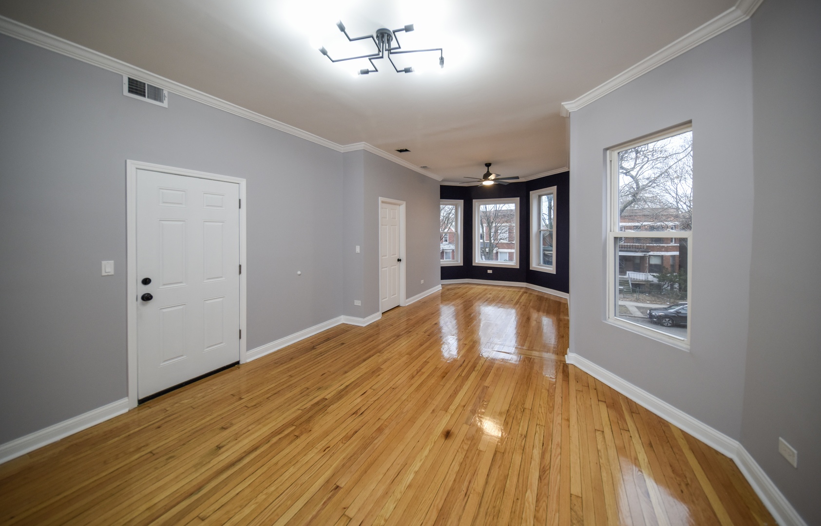 5932 South Elizabeth Street Chicago, IL 60636 - Photo 17 of 25 a view of empty room with wooden floor and fan