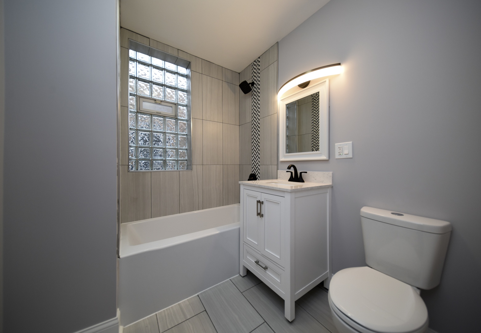 5932 South Elizabeth Street Chicago, IL 60636 - Photo 19 of 25 a bathroom with a sink a toilet and shower