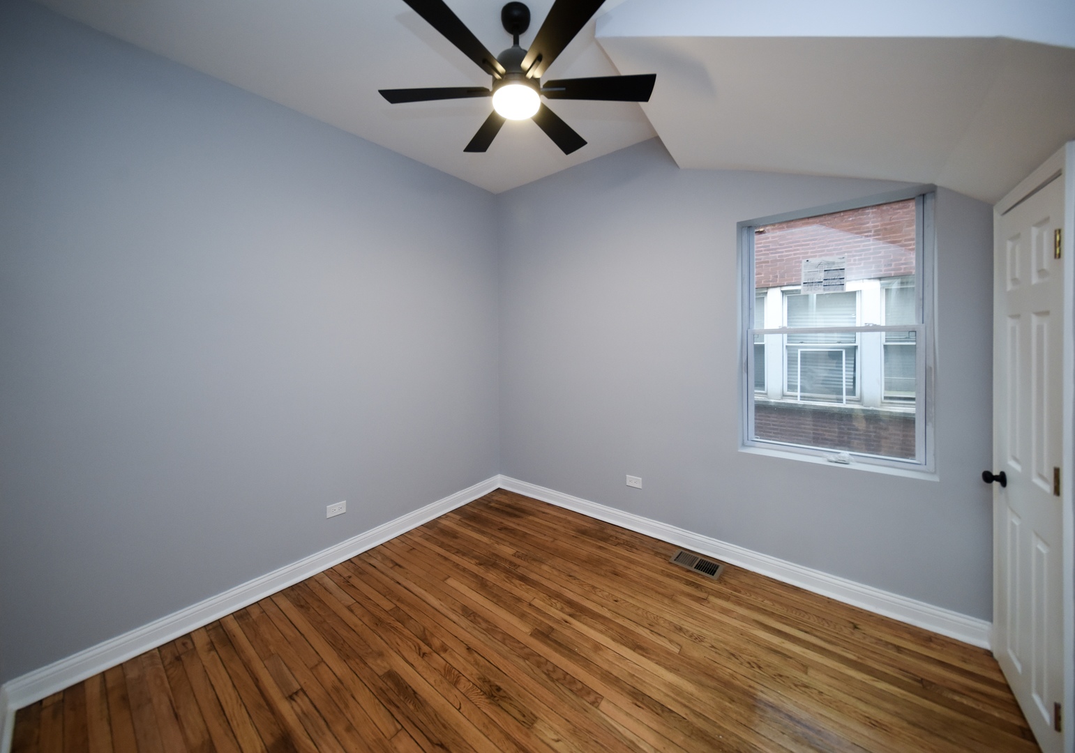 5932 South Elizabeth Street Chicago, IL 60636 - Photo 20 of 25 wooden floor in an empty room with a window