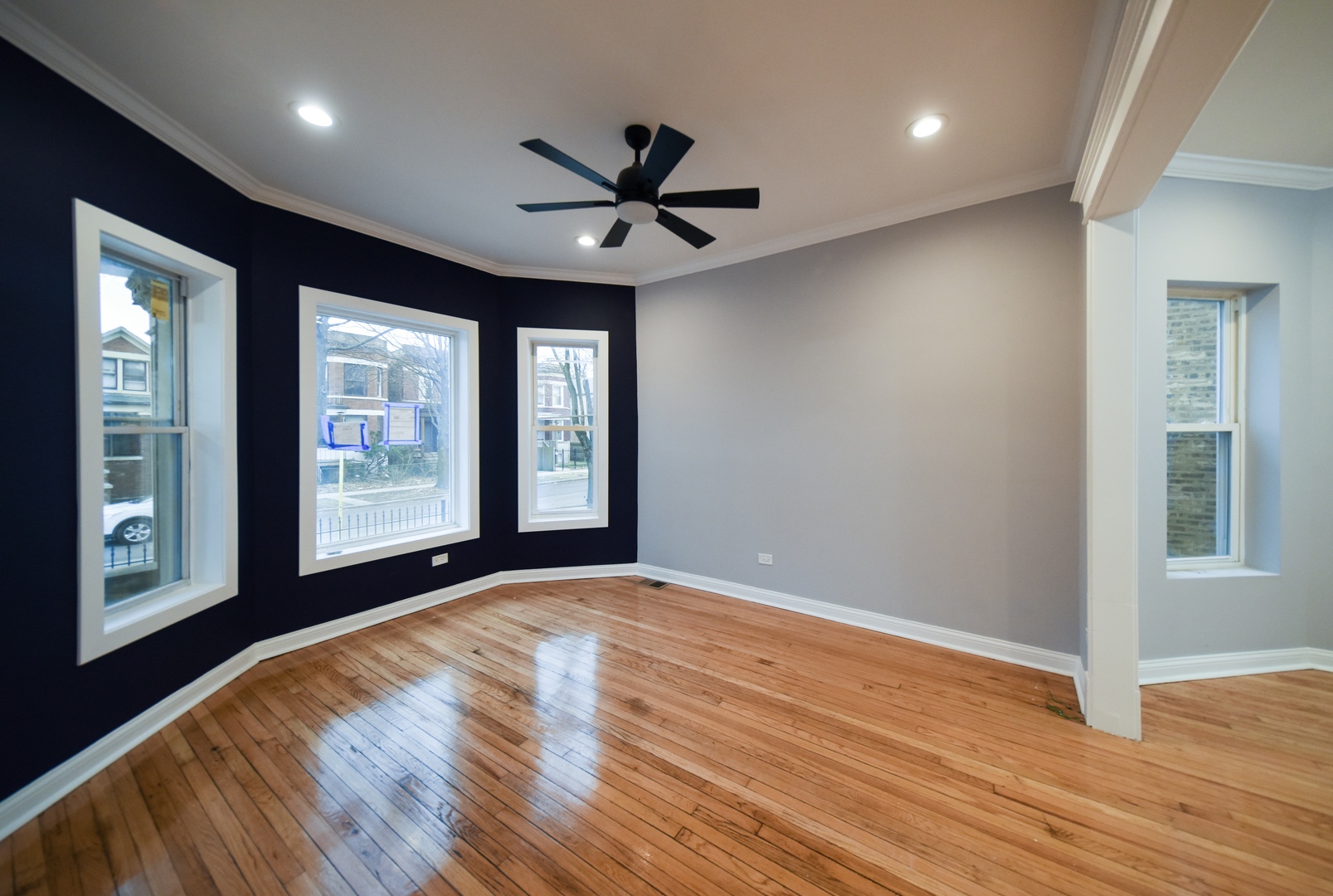 5932 South Elizabeth Street Chicago, IL 60636 - Photo 3 of 25 a view of an empty room with a window and wooden floor