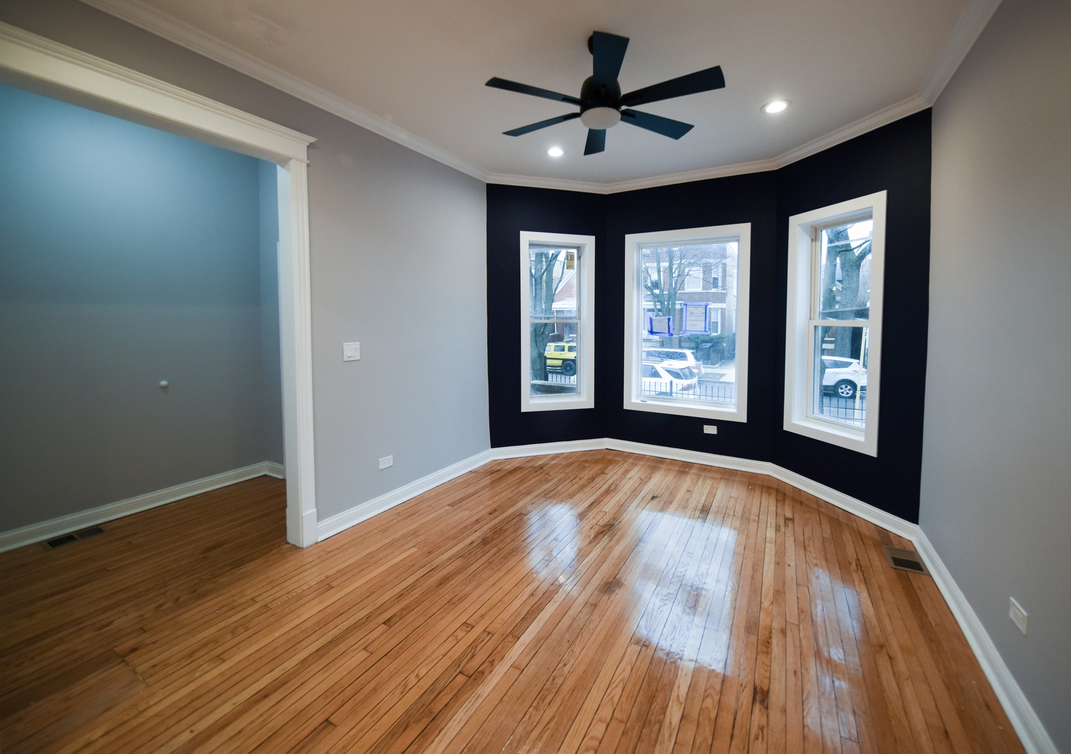 5932 South Elizabeth Street Chicago, IL 60636 - Photo 4 of 25 a view of an empty room with a window and wooden floor