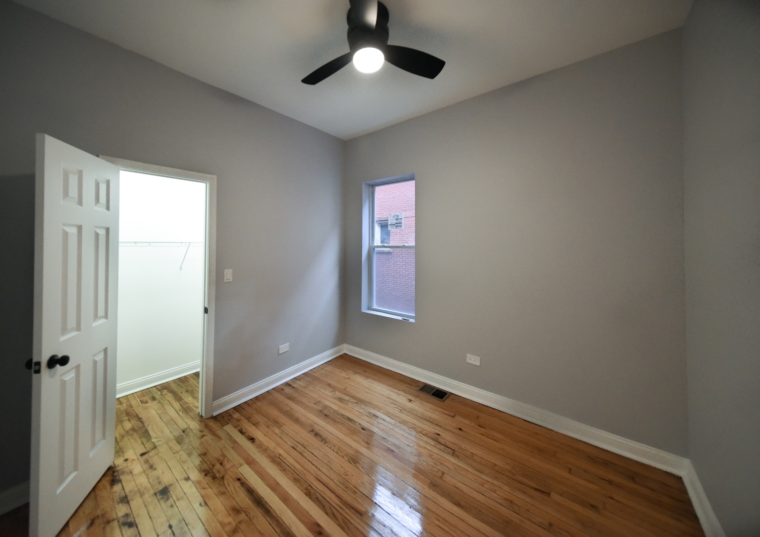 5932 South Elizabeth Street Chicago, IL 60636 - Photo 6 of 25 wooden floor in an empty room with a window