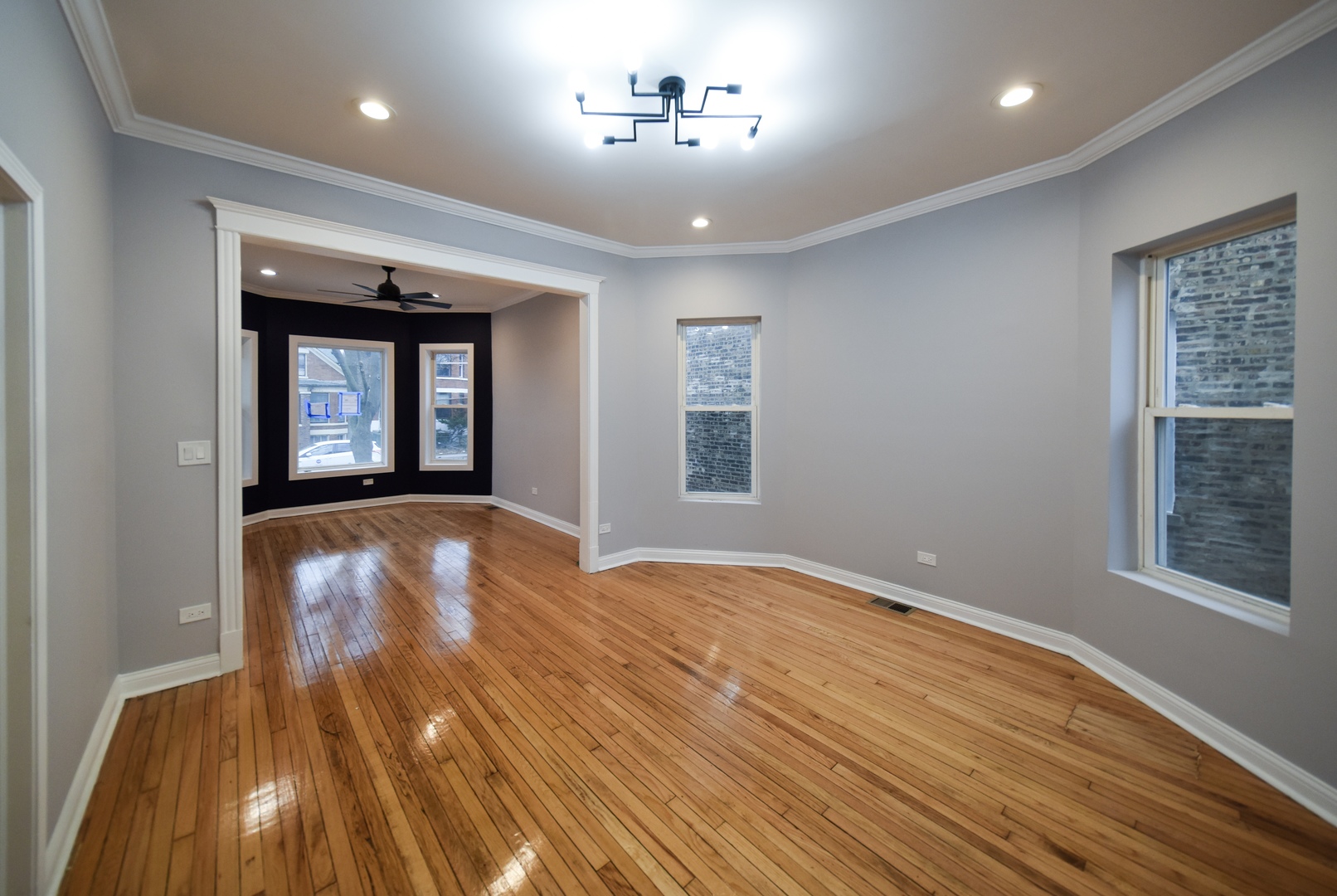 5932 South Elizabeth Street Chicago, IL 60636 - Photo 7 of 25 a view of an empty room with window and wooden floor