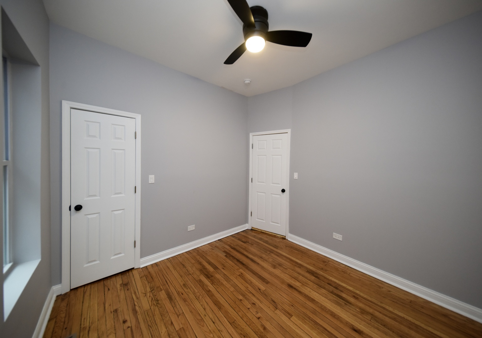 5932 South Elizabeth Street Chicago, IL 60636 - Photo 10 of 25 wooden floor in an empty room