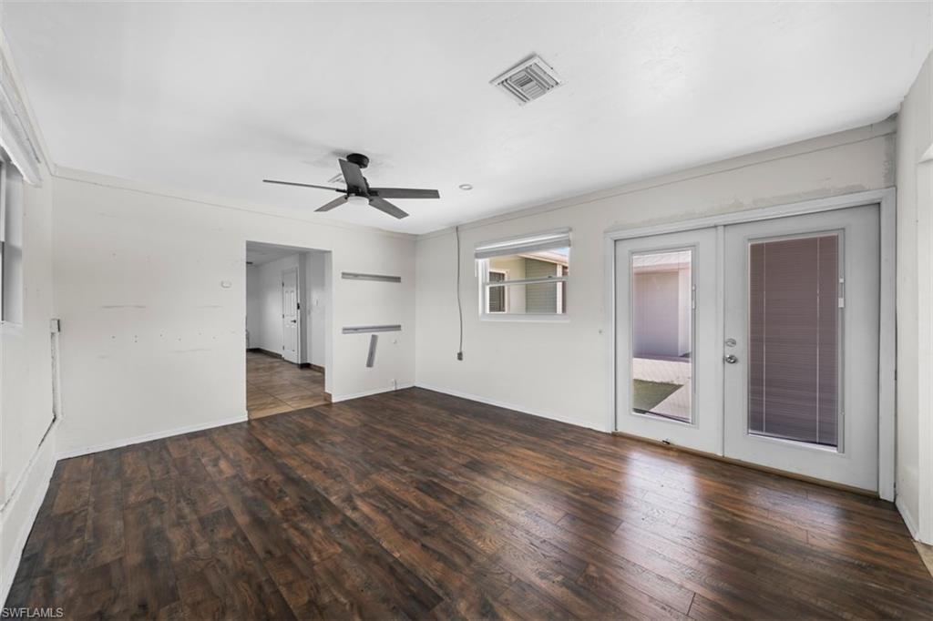 5460 Bayshore Road North Fort Myers, FL 33917 - Photo 11 of 14 a view of empty room with wooden floor and ceiling fan