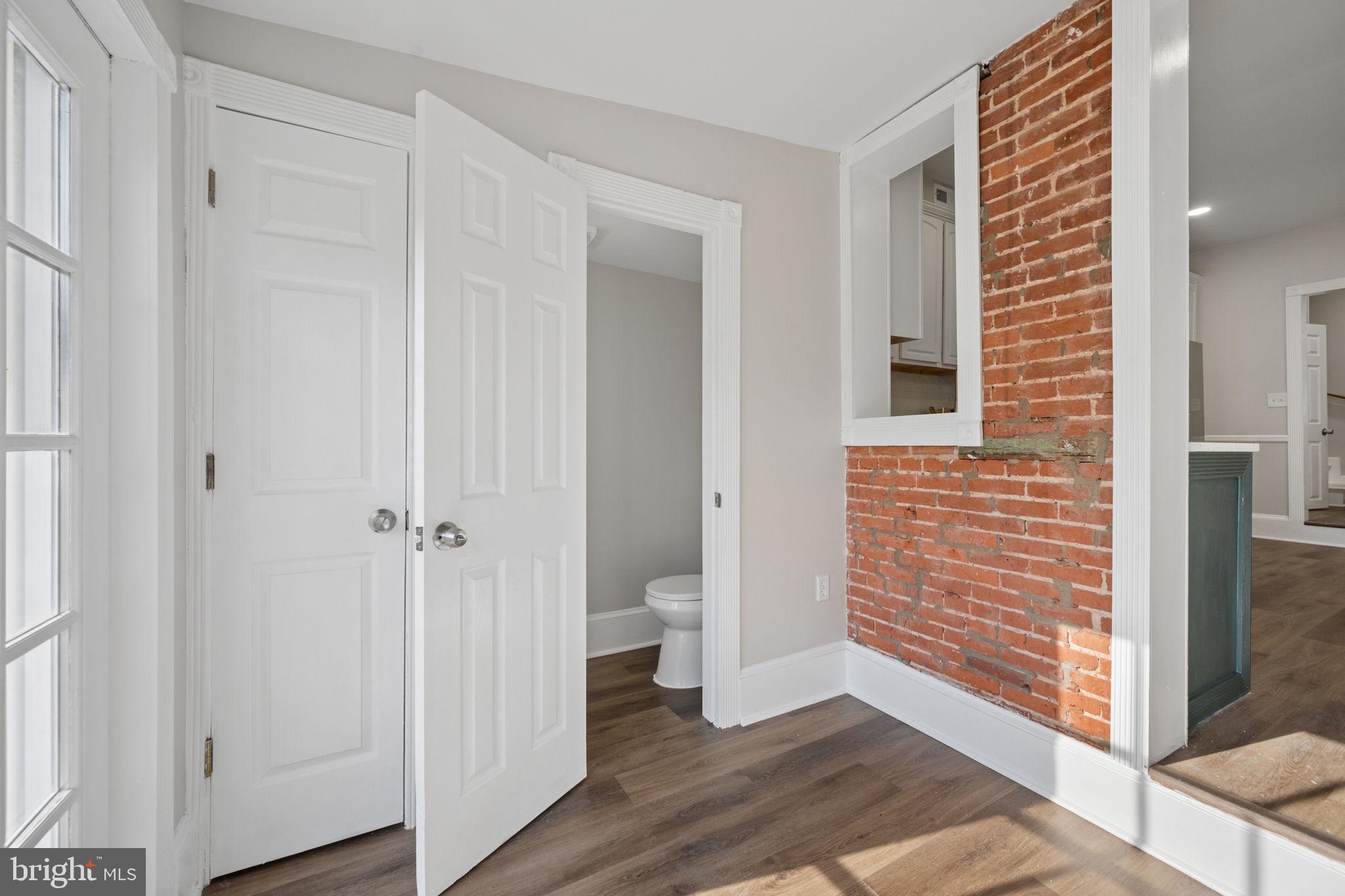 1108 South Clinton Street Baltimore, MD 21224 - Photo 15 of 66 Charming entryway with exposed brick.