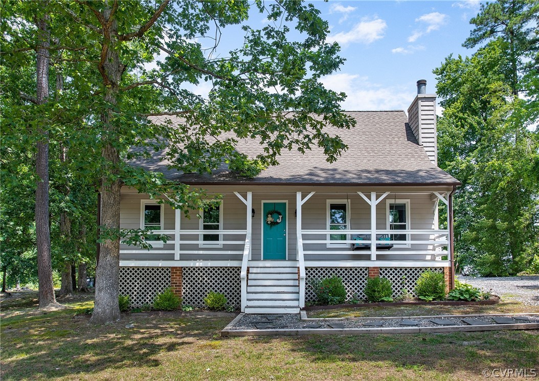 11210 Moravia Road Midlothian, VA 23112 - Photo 1 of 29 a front view of a house with a garden