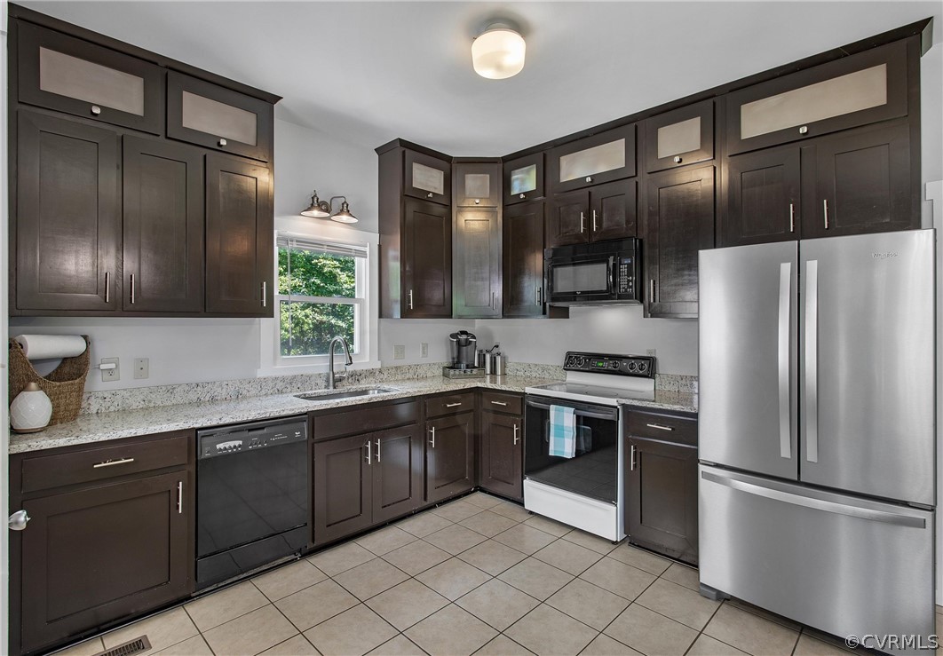 11210 Moravia Road Midlothian, VA 23112 - Photo 11 of 29 a kitchen with stainless steel appliances granite countertop a refrigerator and a sink