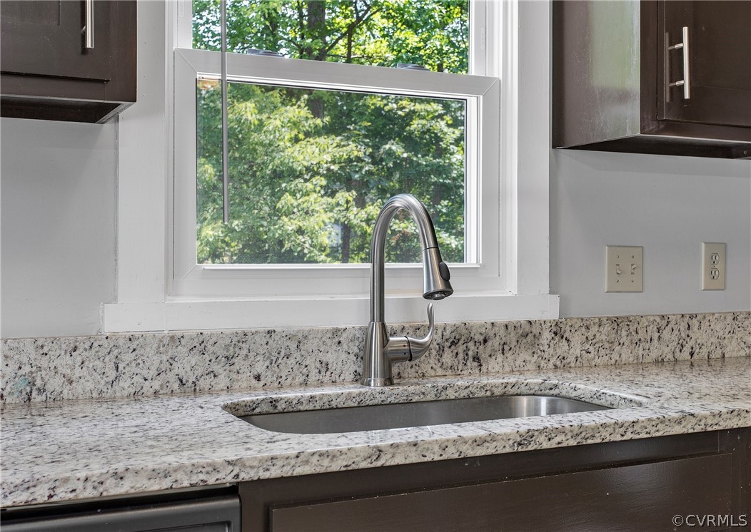 11210 Moravia Road Midlothian, VA 23112 - Photo 12 of 29 a view of a kitchen sink granite counter top and a wooden floor