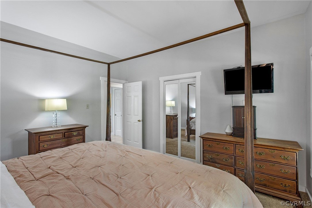 11210 Moravia Road Midlothian, VA 23112 - Photo 15 of 29 a bedroom with a bed and flat screen tv