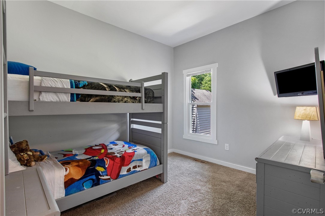 11210 Moravia Road Midlothian, VA 23112 - Photo 16 of 29 a bedroom with furniture and a window