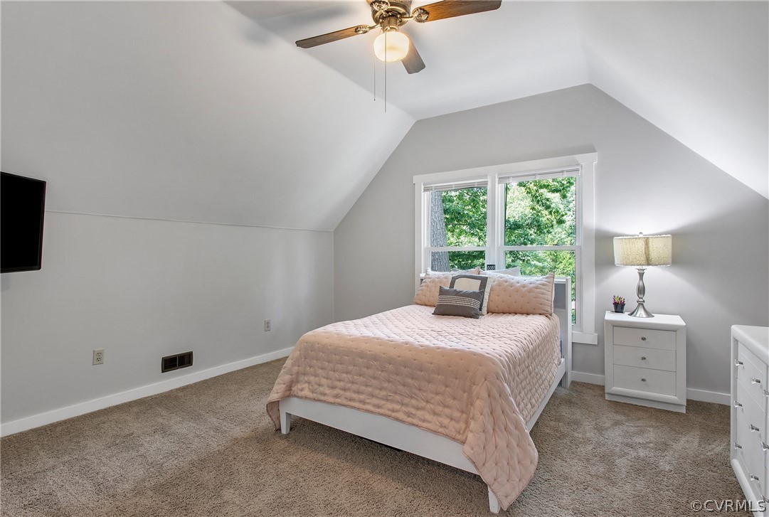 11210 Moravia Road Midlothian, VA 23112 - Photo 18 of 29 a bedroom with a bed and a chandelier