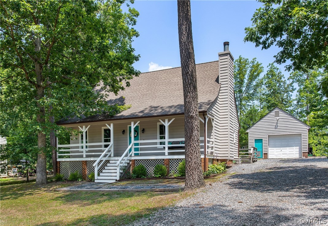11210 Moravia Road Midlothian, VA 23112 - Photo 2 of 29 a front view of a house with a garden