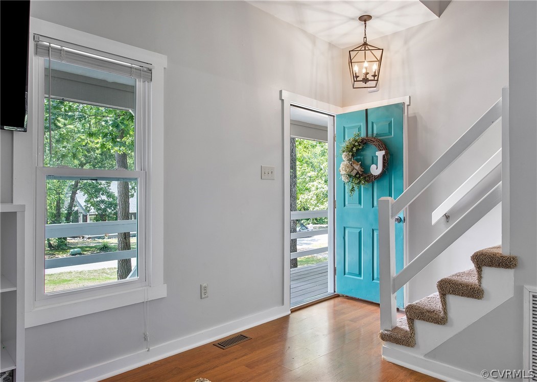 11210 Moravia Road Midlothian, VA 23112 - Photo 6 of 29 a view of an entryway with wooden floor and door