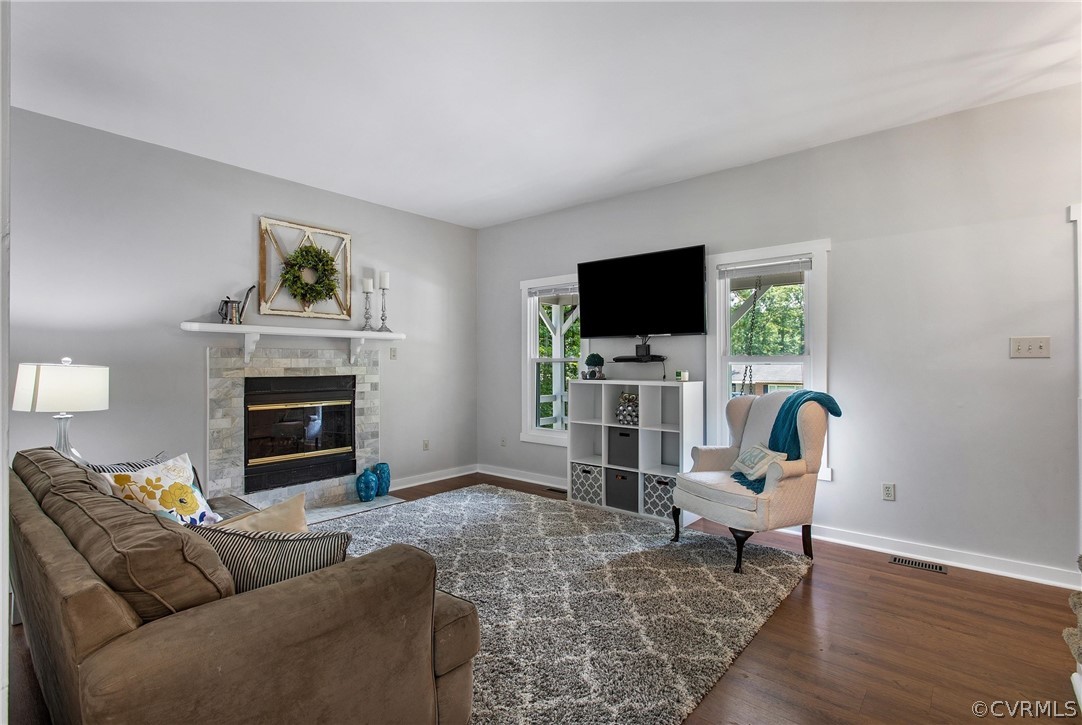 11210 Moravia Road Midlothian, VA 23112 - Photo 8 of 29 a living room with furniture a fireplace and a flat screen tv