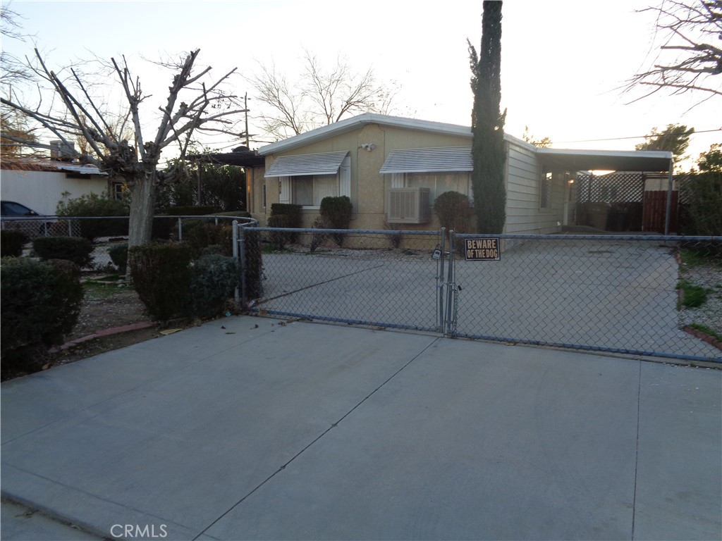 8418 Arrowhead Lake Road Hesperia, CA 92345 - Photo 1 of 1 a view of a car park in front of house