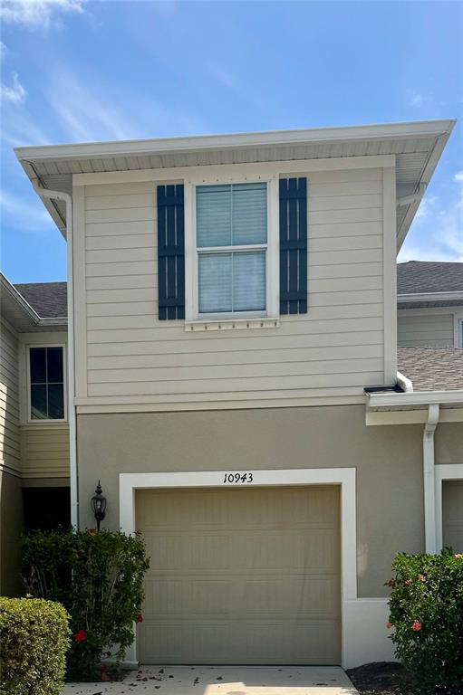 a front view of a house with a garage