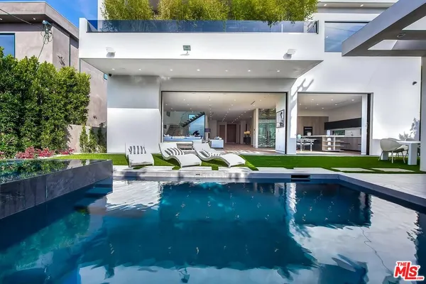 a view of pool with outdoor seating