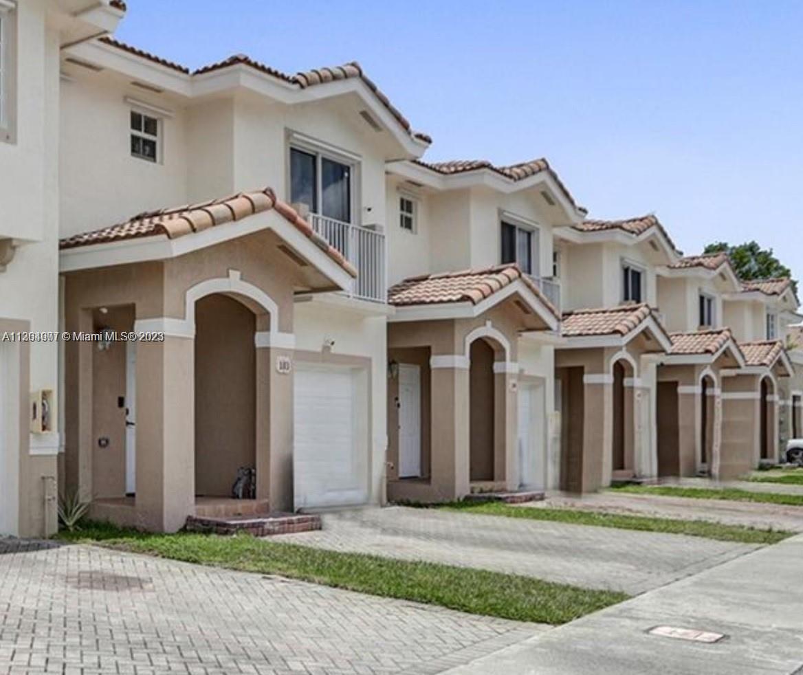 13974 Southwest 260th Street, Unit 102 Homestead, FL 33032 - Photo 16 of 16 a front view of a house