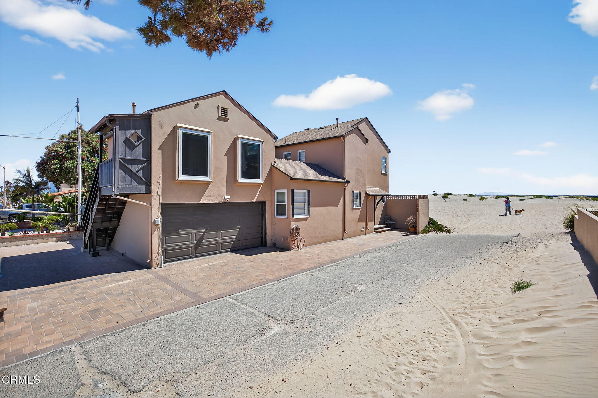 a view of a house with a snow in the background