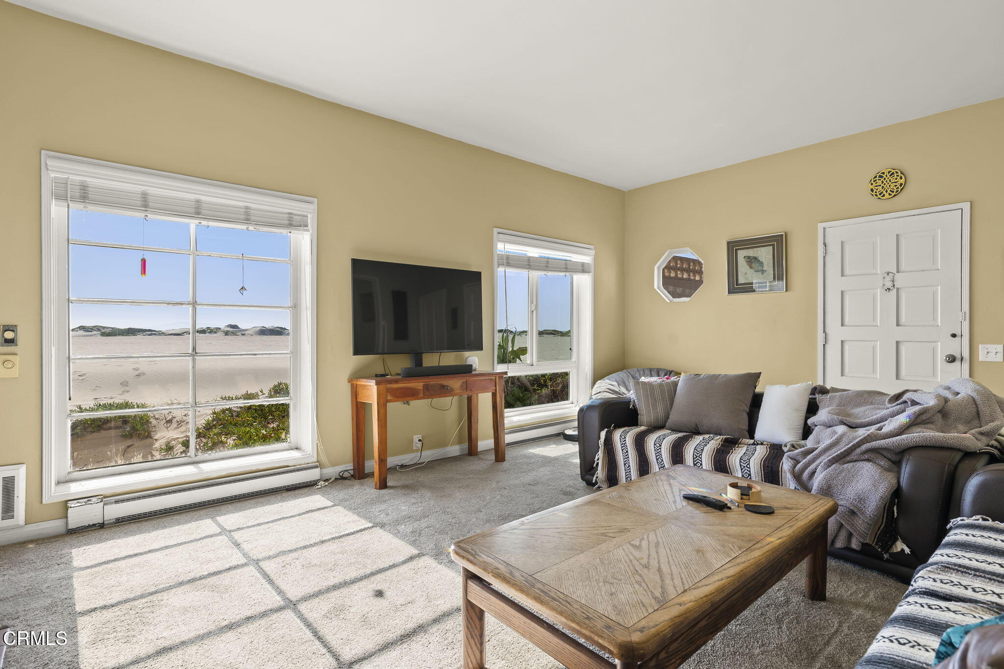 3025 Ocean Drive Oxnard, CA 93035 - Photo 11 of 50 a living room with furniture and a flat screen tv