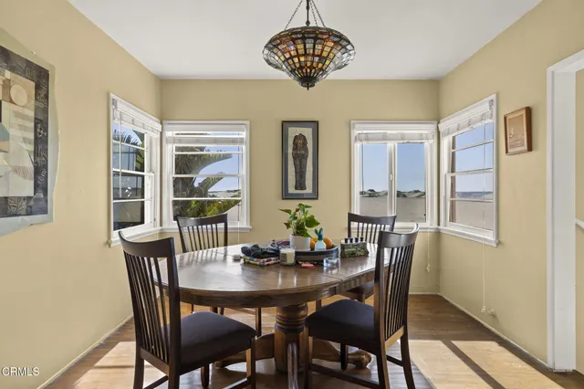 a living room with dining table
