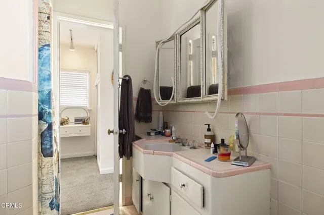 a bathroom with a tub and a sink