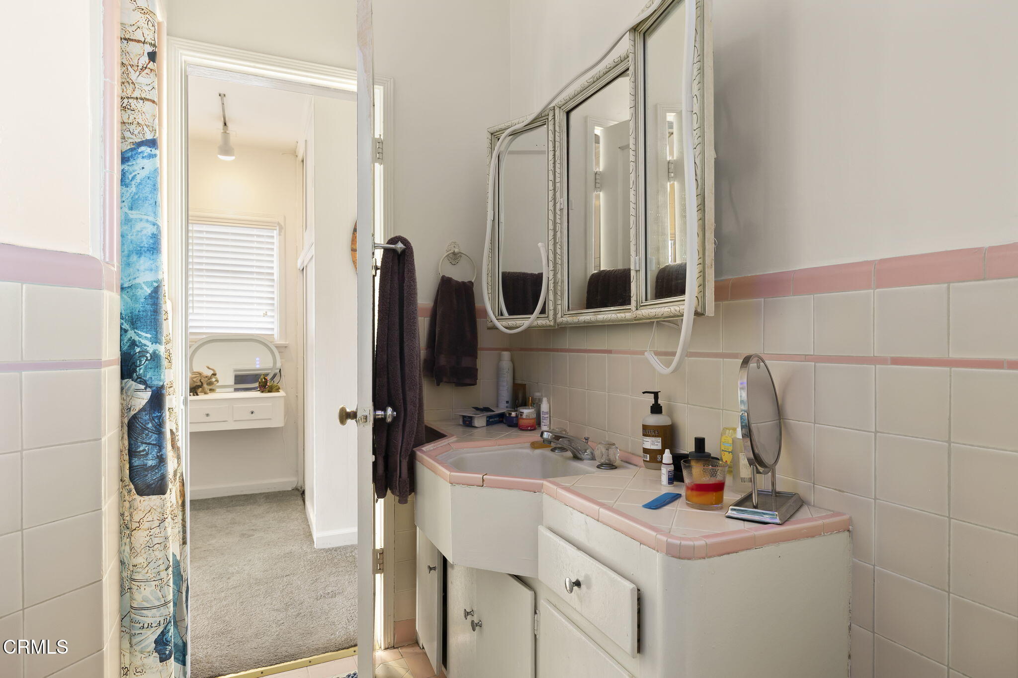 3025 Ocean Drive Oxnard, CA 93035 - Photo 20 of 50 a bathroom with a sink vanity and a mirror